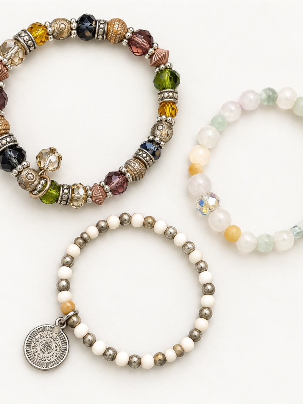 Lot of 3 assorted beaded stretch bracelets in mixed colors and styles.
